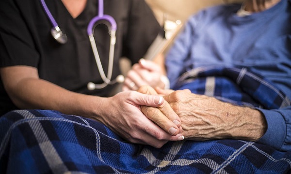 Hospice Nurse Visiting An Elderly Male Patient Bharmal Associates 